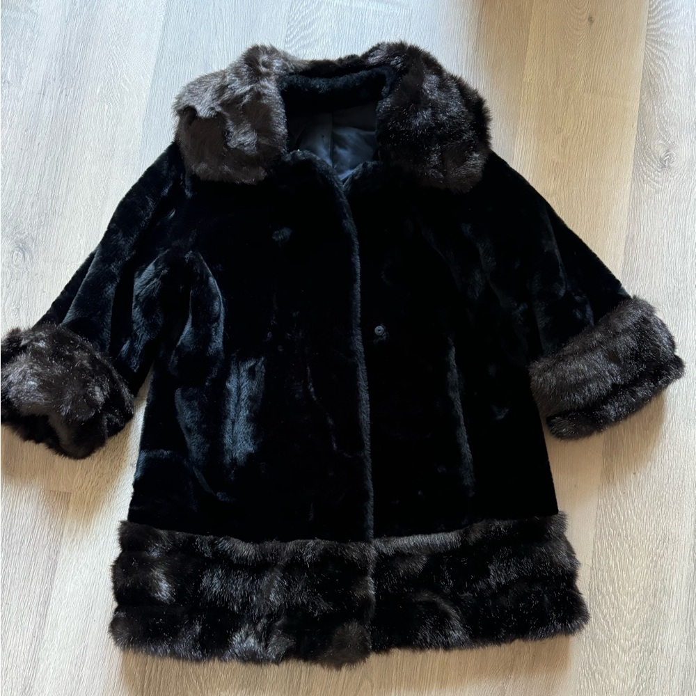 Faux fur coat. Black with faux fur brown trim.